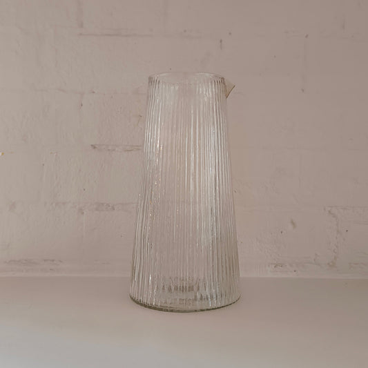 Tall ribbed glass carafe